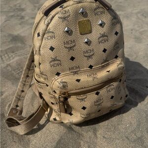 ❌❌❌ SOLD ❌❌❌ 
MCM Beige Logo-Print Mini Backpack with Gold Hardware